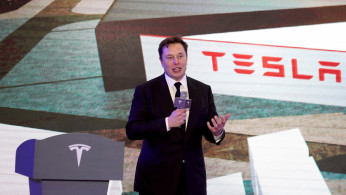 FILE PHOTO: Tesla Inc CEO Elon Musk speaks at an opening ceremony for Tesla China-made Model Y program in Shanghai