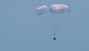The SpaceX Crew Dragon Endeavour spacecraft is seen as it lands with NASA astronauts Robert Behnken and Douglas Hurley onboard