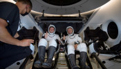 NASA astronauts are seen inside the SpaceX Crew Dragon Endeavour spacecraft