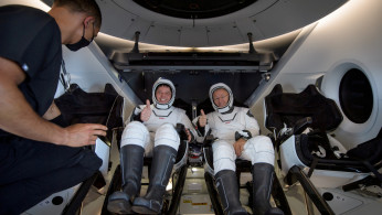 NASA astronauts are seen inside the SpaceX Crew Dragon Endeavour spacecraft