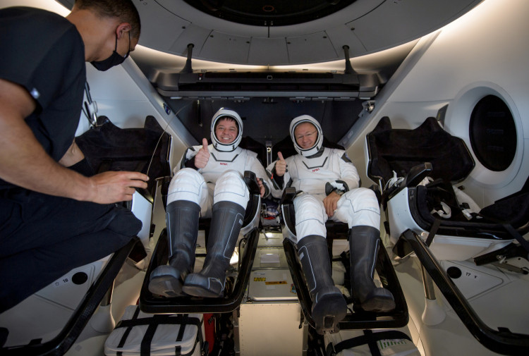 NASA astronauts are seen inside the SpaceX Crew Dragon Endeavour spacecraft