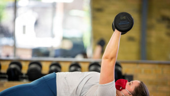 Rachel Aitken works out at Hone Fitness after indoor dining restaurants, gyms and cinemas re-opened under Phase 3 rules from coronavirus disease (COVID-19) restrictions