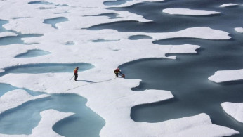 The crew of the U.S. Coast Guard Cutter Healy, in the midst of their ICESCAPE mission, retrieves supplies dropped by parachute in the Arctic Ocean