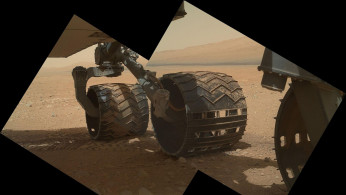 This view of the three left wheels of NASA's Mars rover Curiosity combines two images that were taken by the rover during the 34th Martian day
