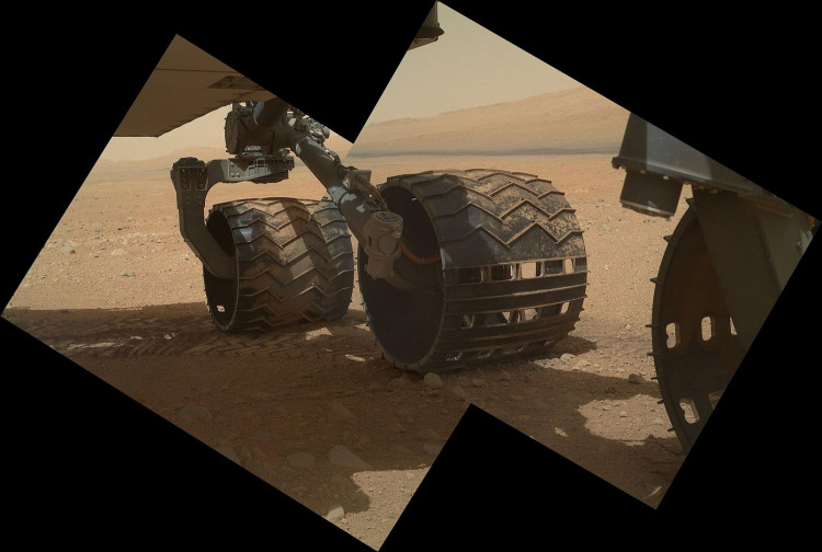 This view of the three left wheels of NASA's Mars rover Curiosity combines two images that were taken by the rover during the 34th Martian day
