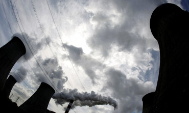 FILE PHOTO: Smoke billows from the chimneys of Europe's largest biggest coal-fired power plant, May 7, 2009. 