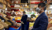 Men wear protective face masks and gloves, following the outbreak of coronavirus, as they are seen in a nuts shop in Tehran, Iran March 17, 2020.