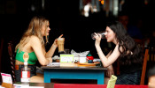 Diners have lunch outside a restaurant 