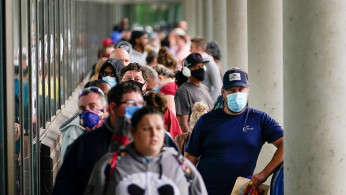 Hundreds of people line up outside a Kentucky Career Center