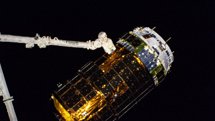 ISS-63 HTV-9 cargo ship in the grips of the Canadarm2