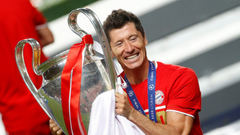 Munich's Robert Lewandowski celebrates with the trophy