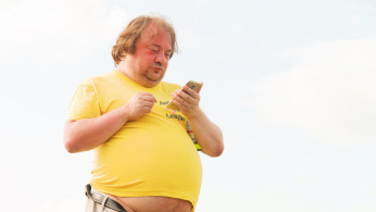 man in yellow shirt