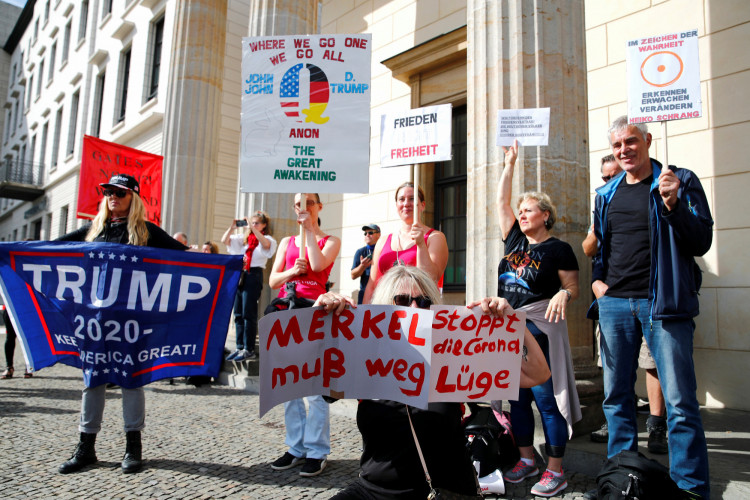 Protesters demonstrate in front of the Reichstag Building