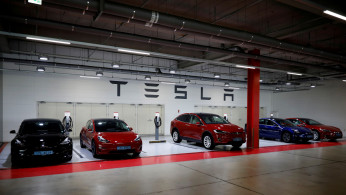 FILE PHOTO: Tesla electric vehicles for test driving are parked in Hanam
