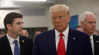 U.S. President Donald Trump is accopmpanied by U.S. Rep. Bryan Steil 