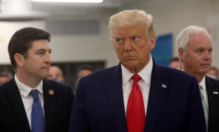U.S. President Donald Trump is accopmpanied by U.S. Rep. Bryan Steil 