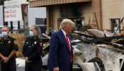 U.S. President Donald Trump views property damage 