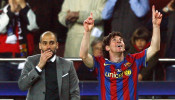Barcelona's Messi celebrates in front of coach Guardiola after scoring against VfB Stuttgart during their Champions League match in Barcelona