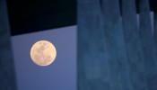 The moon is seen outside the Planalto Palace in Brasilia, Brazil, September 1, 2020.