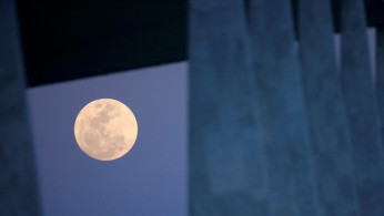 The moon is seen outside the Planalto Palace in Brasilia, Brazil, September 1, 2020.