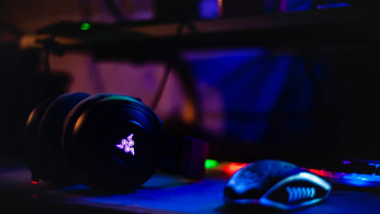 Razer headset near computer mouse