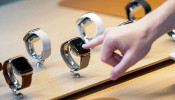 A customer checks Apple watches at the grand opening of the new Apple Carnegie Library store in Washington