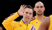 FILE PHOTO: Los Angeles Lakers Nash and Sacre of Canada celebrate during their NBA basketball game against Oklahoma City Thunder in Los Angeles