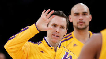 FILE PHOTO: Los Angeles Lakers Nash and Sacre of Canada celebrate during their NBA basketball game against Oklahoma City Thunder in Los Angeles
