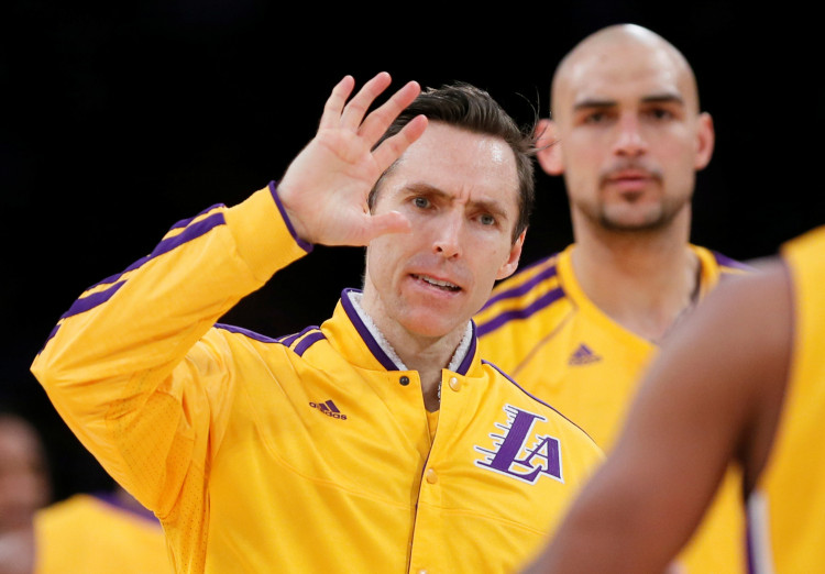 FILE PHOTO: Los Angeles Lakers Nash and Sacre of Canada celebrate during their NBA basketball game against Oklahoma City Thunder in Los Angeles