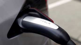A Tesla car is charged