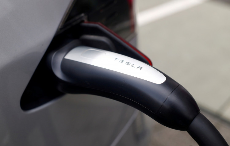 A Tesla car is charged