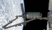 The International Space Station's Canadarm2 unberths the Orbital Sciences Corporation's Cygnus spacecraft after several weeks at the space station