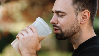 man drinking shake