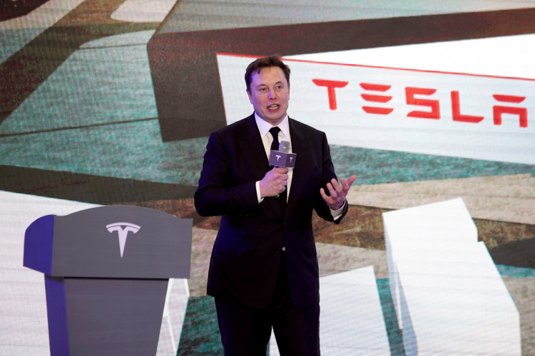FILE PHOTO: Tesla Inc CEO Elon Musk speaks at an opening ceremony for Tesla China-made Model Y program in Shanghai, China January 7, 2020