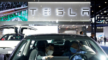 Tesla sign is seen at the third China International Import Expo (CIIE) in Shanghai