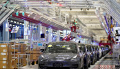 FILE PHOTO: Tesla China-made Model 3 vehicles are seen during a delivery event at its factory in Shanghai