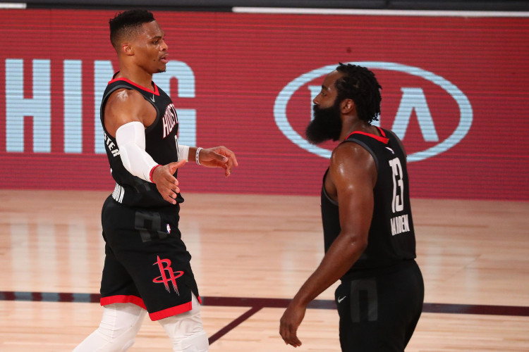 NBA: Houston Rockets guard Russell Westbrook (left) celebrates with guard James Harden (13)