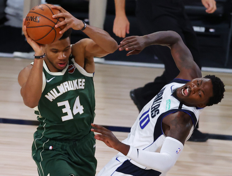 NBA: Giannis Antetokounmpo #34 of the Milwaukee Bucks collides with Dorian Finney-Smith #10 of the Dallas Maverick
