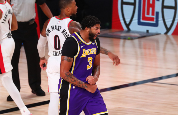 NBA: Los Angeles Lakers forward Anthony Davis (3) reacts after dunking against the Portland Trail Blazers