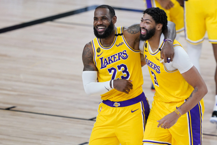 NBA: Los Angeles Lakers' LeBron James (23) and Anthony Davis (3) celebrate after defeating the Denver Nuggets 124-121