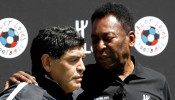 FILE PHOTO: Football legends Pele and Diego Maradona attend an advertising soccer event on the eve of the opening of the UEFA 2016 European Championship in Paris