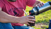 pouring water from a thermos