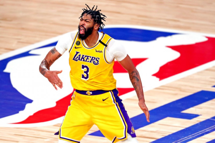 NBA: Los Angeles Lakers forward Anthony Davis (3) celebrates after making a three pointer during the fourth quarter against the Miami Heat in game 4 of the 2020 NBA Finals