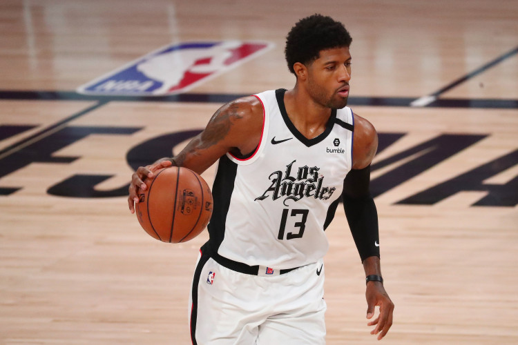 NBA: LA Clippers guard Paul George (13) brings the ball up court