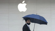 FILE PHOTO: Man walks past an Apple store in Taipei