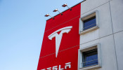 FILE PHOTO: The logo of Tesla is seen at a branch office in Bern, Switzerland March 25, 2020