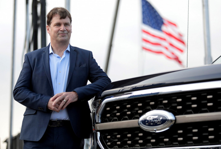 FILE PHOTO: Ford Motor Co. CEO Jim Farley poses next to a new 2021 Ford F-150 pickup truck at the Rouge Complex in Dearborn,