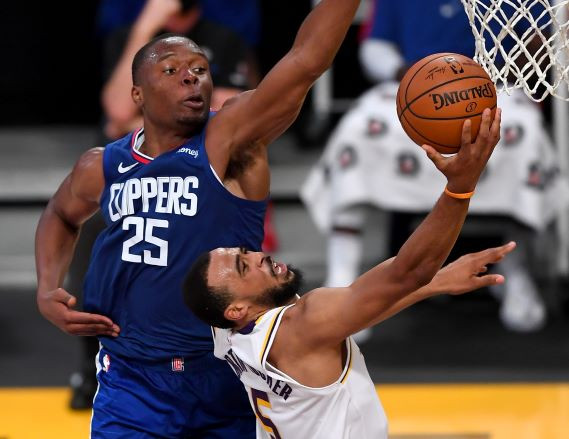  Los Angeles Clippers forward Mfiondu Kabengele (25) defends a shot by Los Angeles Lakers guard Talen Horton-Tucker