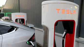 FILE PHOTO: A Tesla Supercharger station is seen in Dietikon