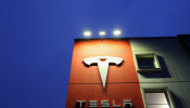 A logo of car manufacturer Tesla is seen at a branch office in Bern, Switzerland December 10, 2020